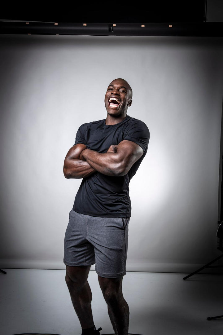 Paul Olima, Boddy Laundry partner, laughing with his arms crossed